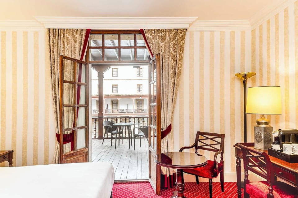 Premium Room, Terrace (Patio de La Reina View) | Down comforters, minibar, in-room safe, desk