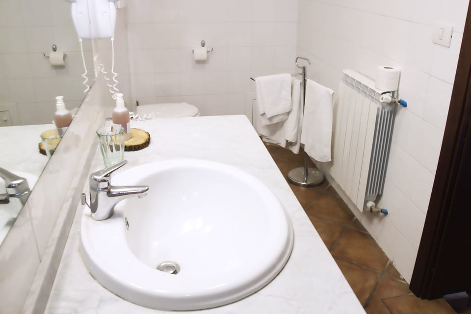 Quadruple Room | Bathroom | Shower, free toiletries, hair dryer, bathrobes