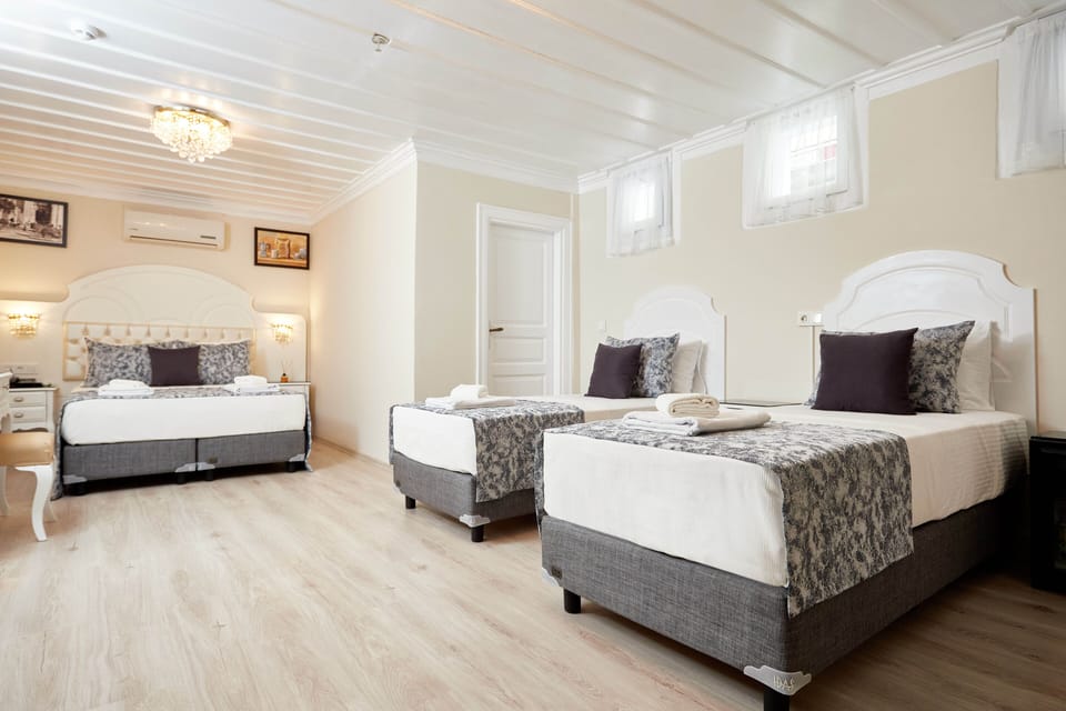 Economy Quadruple Basement Room | Premium bedding, minibar, in-room safe, desk