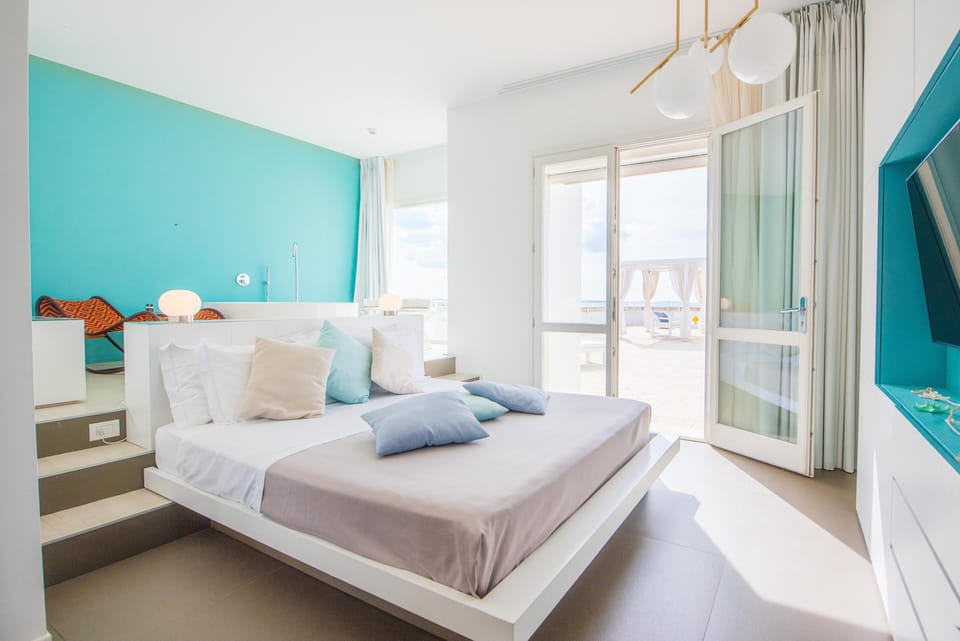 Deluxe Triple Room, Terrace, Sea View | Premium bedding, minibar, in-room safe, desk
