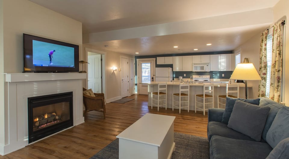 Premium Suite, 1 King Bed, Fireplace | Living area | 42-inch flat-screen TV with cable channels, TV