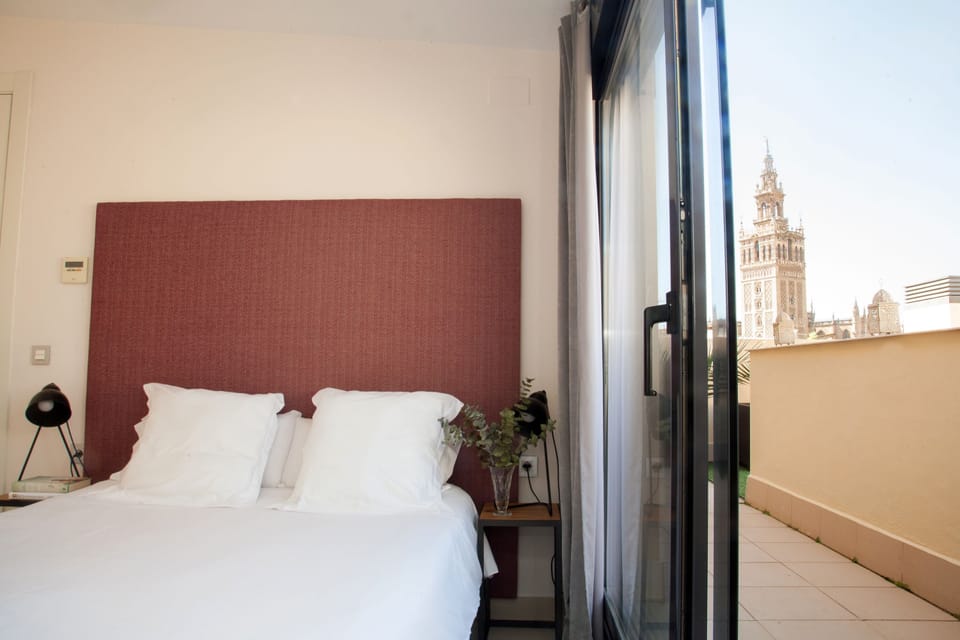 Deluxe Penthouse, 2 Bedrooms, Terrace, City View | In-room safe, desk, laptop workspace, blackout drapes