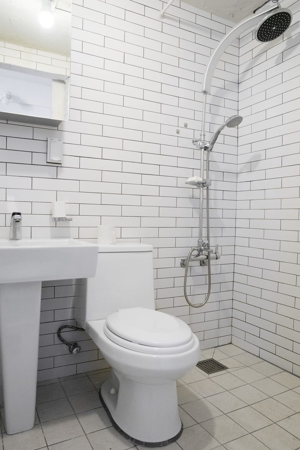 Twin Room (Super Single) | Bathroom | Shower, rainfall showerhead, hair dryer, slippers