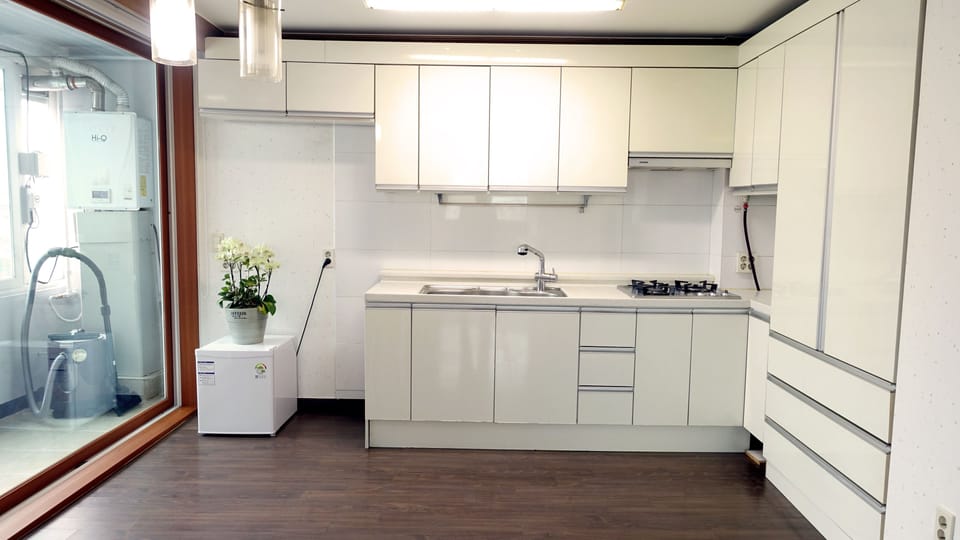 Family Room | Private kitchen | Fridge, electric kettle