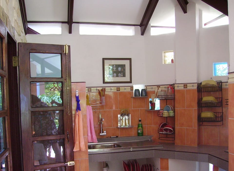 Comfort House, 2 Bedrooms, Kitchenette, Pool View | Private kitchen | Fridge, electric kettle, cleaning supplies, dining tables