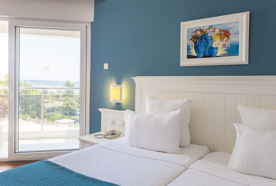 Standard Room, Partial Sea View | Free minibar, soundproofing, free WiFi