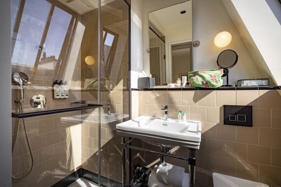 Chambre Parisienne | Bathroom | Free toiletries, hair dryer, bathrobes, slippers