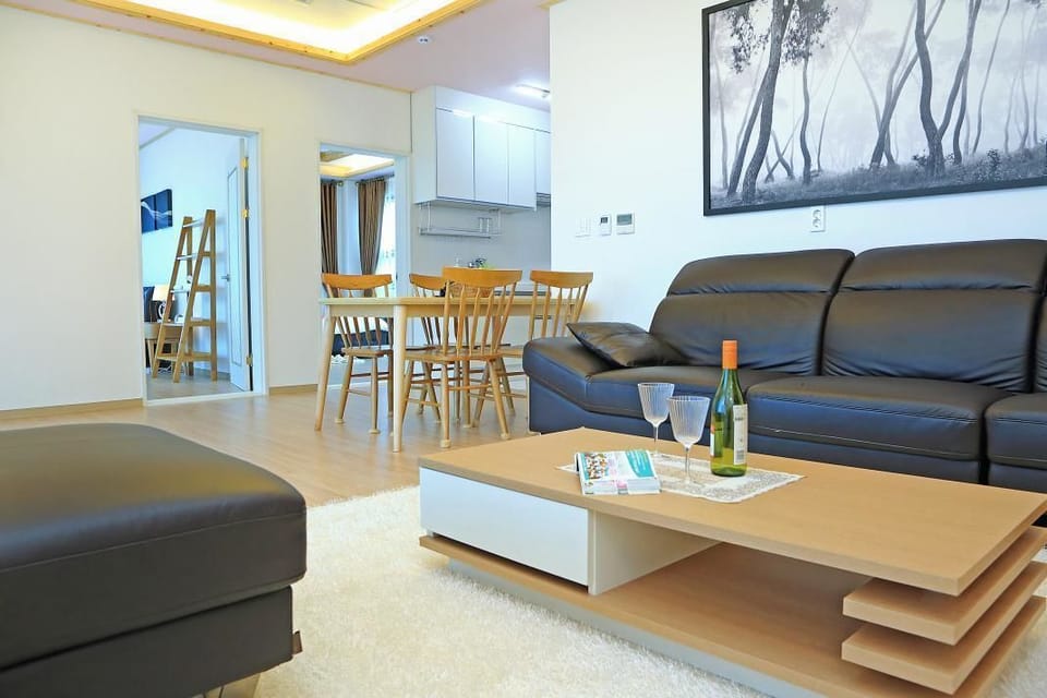 Double Room, 2 Double Beds, Non Smoking, Sea View | Living area | Flat-screen TV