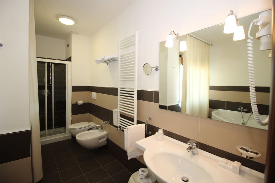 Standard Triple Room, Garden View | Bathroom | Shower, free toiletries, hair dryer, slippers