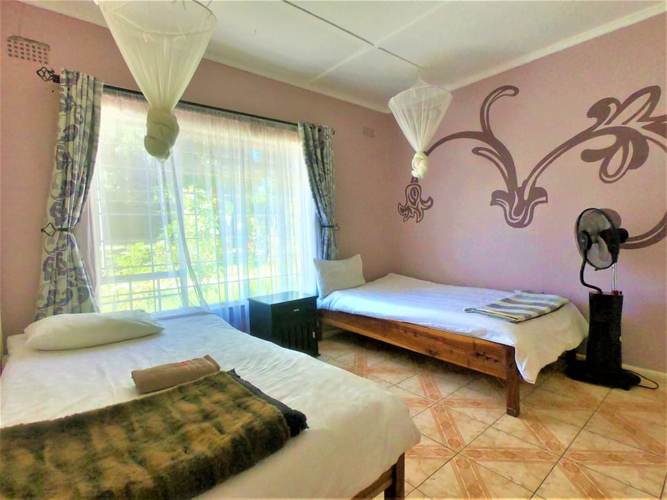Twin Room, Shared Bathroom | In-room safe, rollaway beds, free WiFi, bed sheets