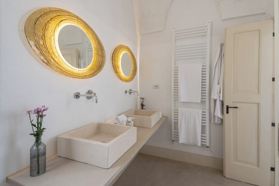 Grand Suite | Bathroom | Shower, rainfall showerhead, designer toiletries, hair dryer