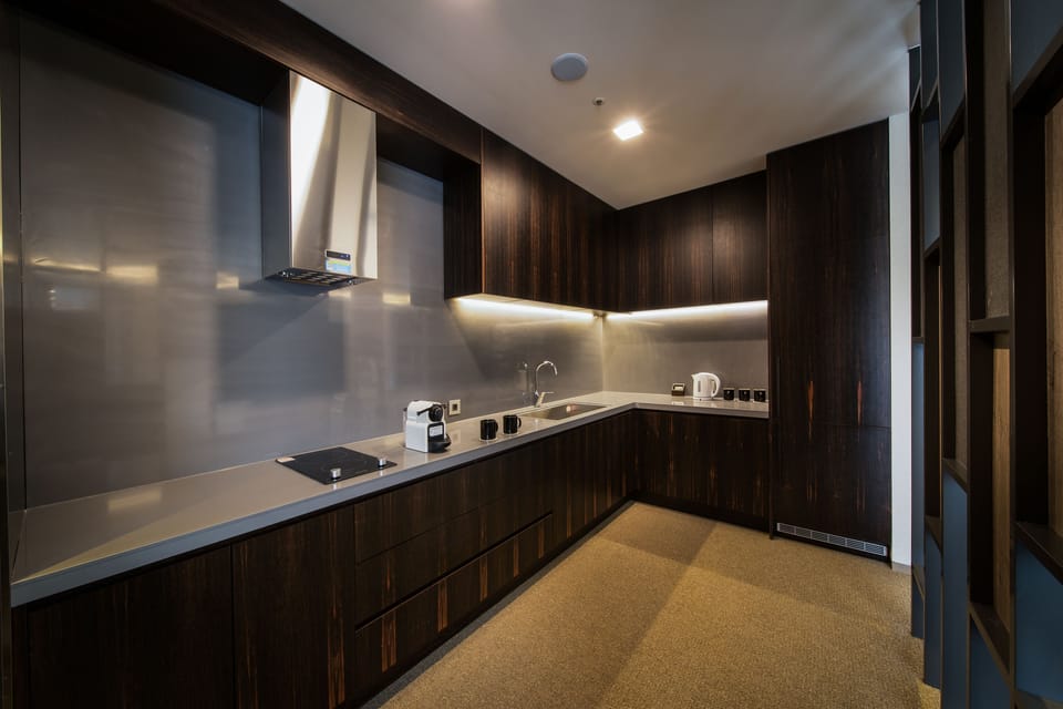 Suite (B) | Living area | 50-inch LCD TV with cable channels, TV, pay movies