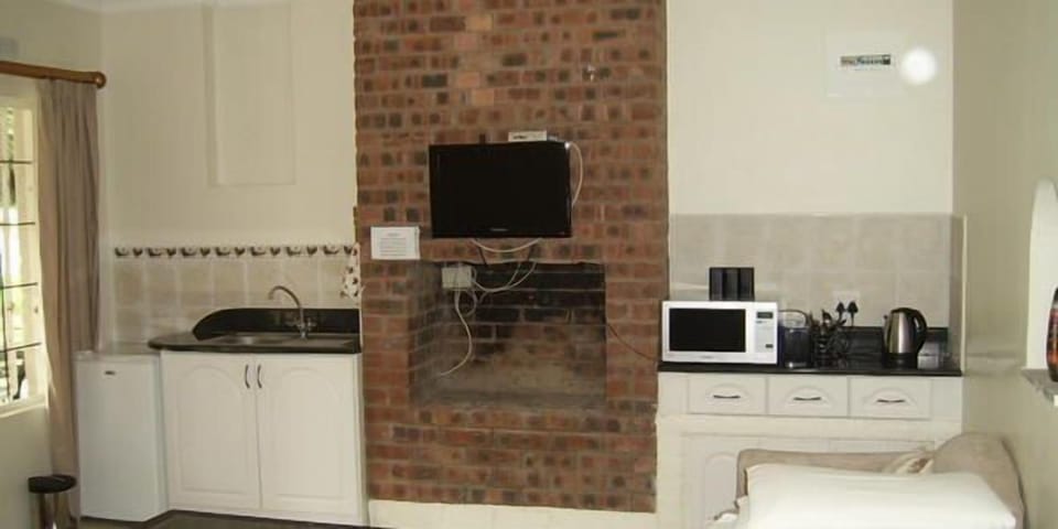 Fridge, electric kettle, cookware/dishes/utensils