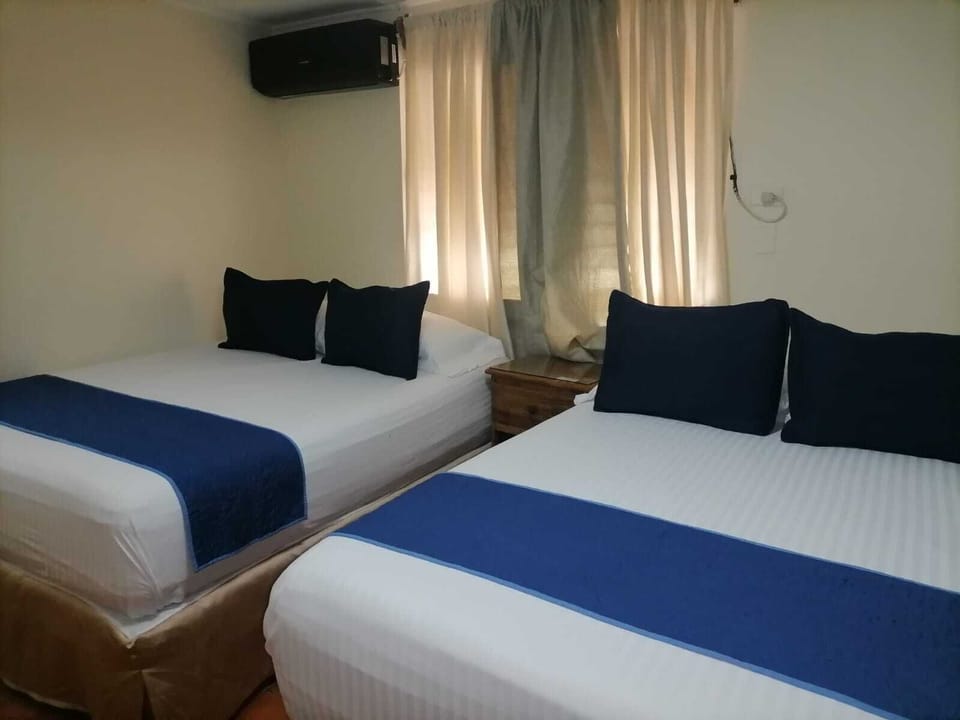 Standard Double Room, 2 Queen Beds | Iron/ironing board (on request), rollaway beds (surcharge), WiFi (free)