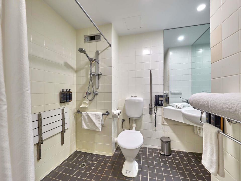 Deluxe Room, 1 King Bed, Accessible, Balcony | In-room safe, desk, laptop workspace, blackout drapes