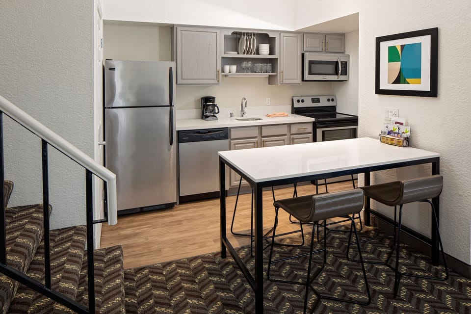 Suite, 2 Bedrooms | Private kitchen | Full-size fridge, microwave, stovetop, dishwasher