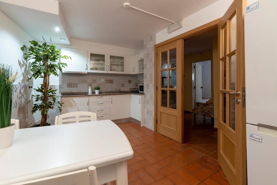 Fridge, electric kettle, cookware/dishes/utensils