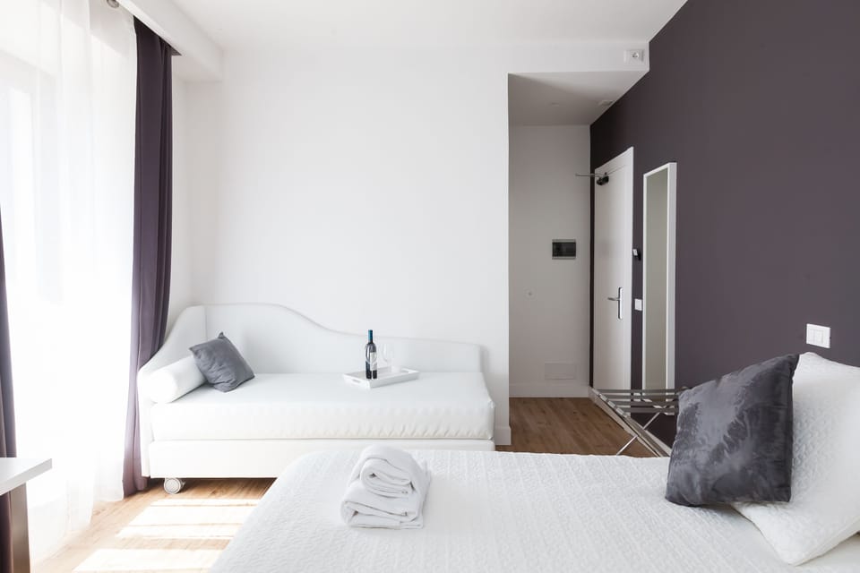 Superior Triple Room | Minibar, in-room safe, desk, soundproofing