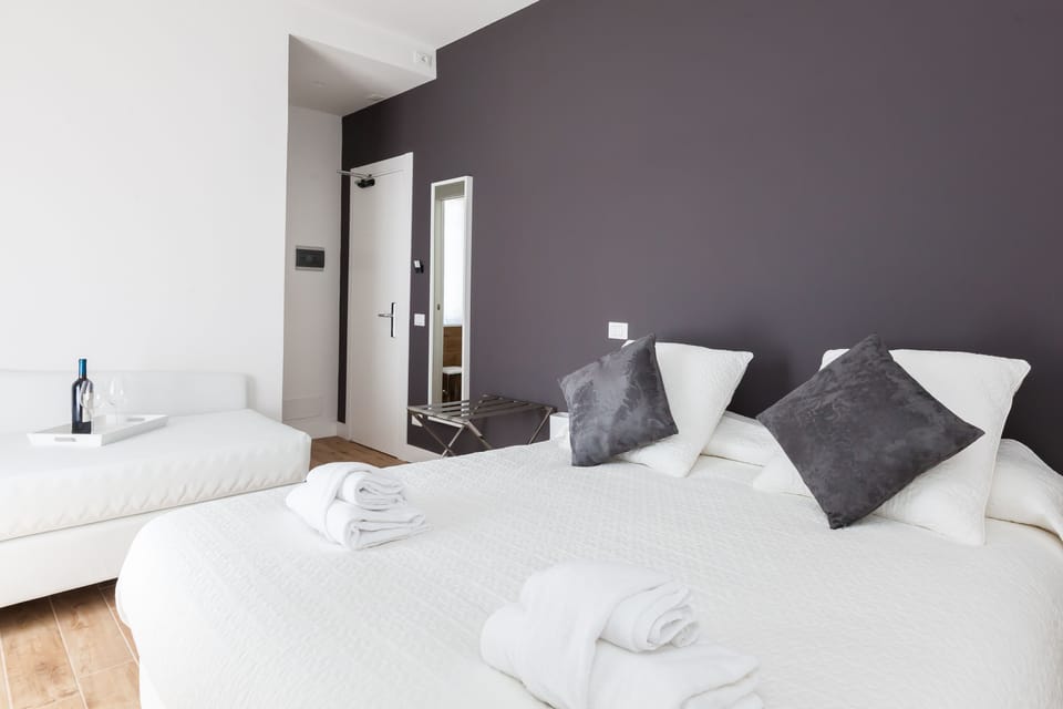 Superior Triple Room | Minibar, in-room safe, desk, soundproofing