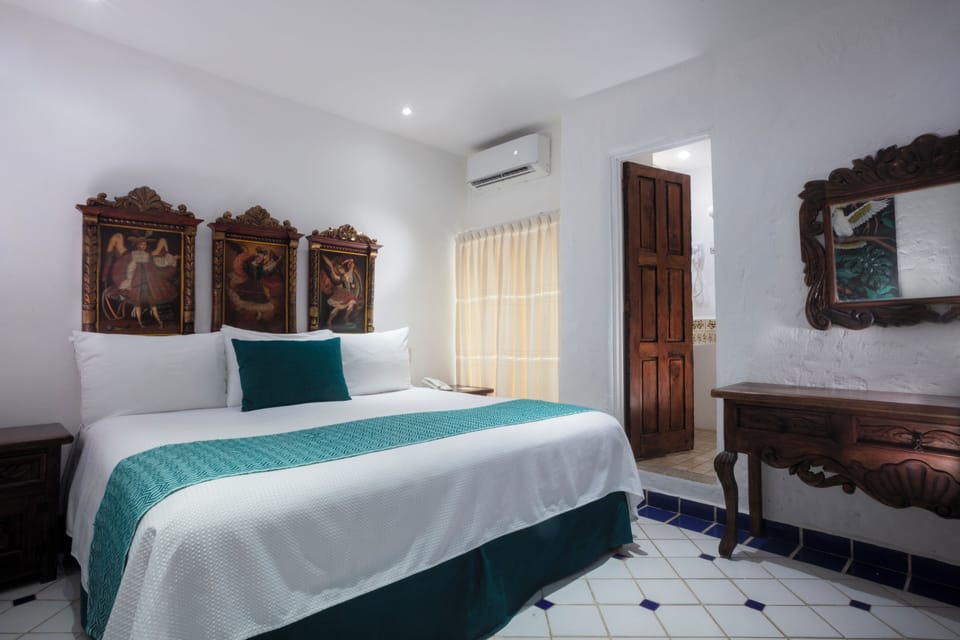 Standard Room, 1 King Bed | Premium bedding, in-room safe, individually decorated, blackout drapes