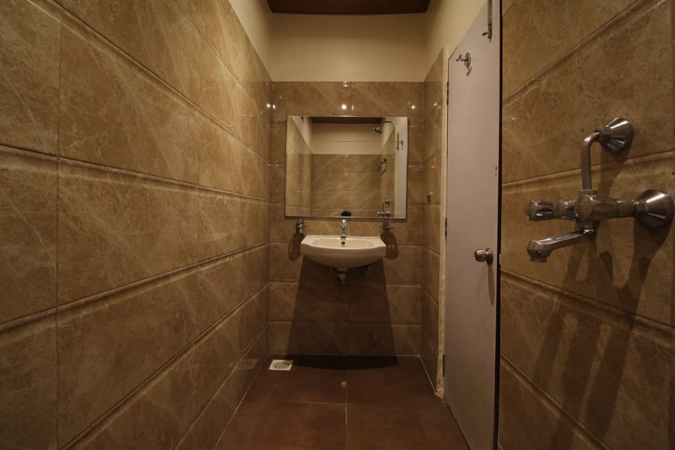 Triple Bed Non AC Room  | Bathroom | Shower, free toiletries, hair dryer, towels