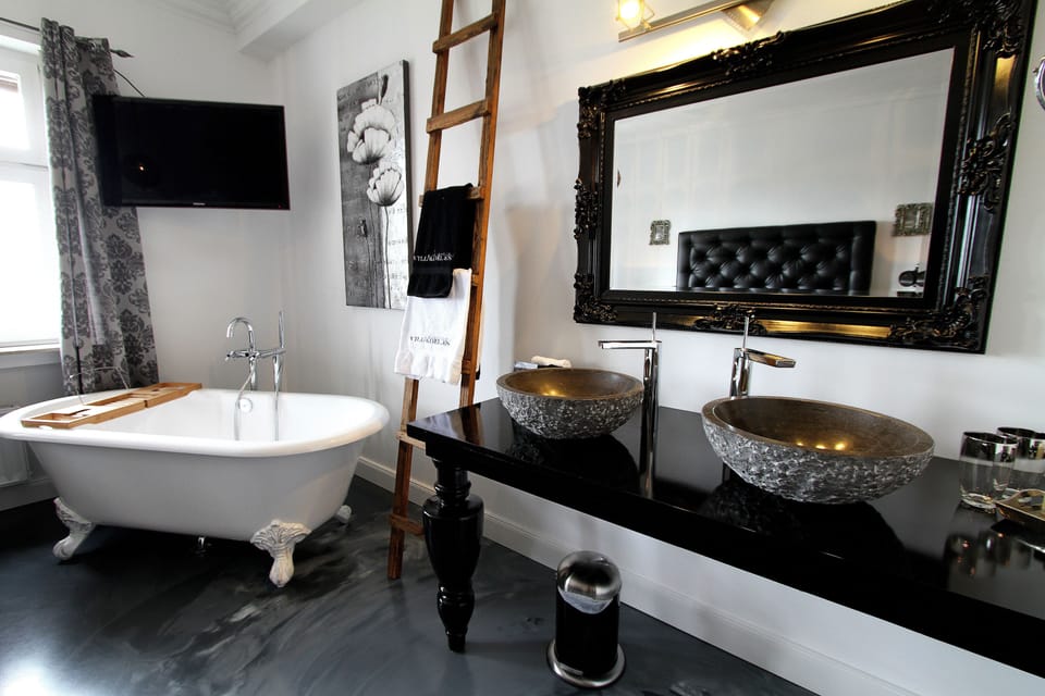 Designer toiletries, hair dryer, bathrobes