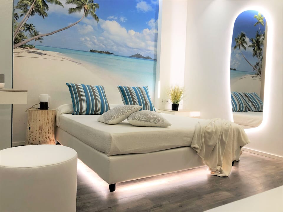 Deluxe Triple Room, Balcony, Partial Sea View (beach access included) | In-room safe, WiFi (free), bed sheets
