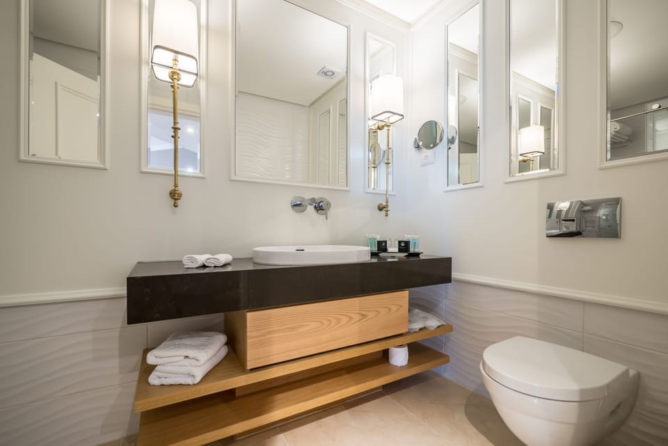 Shower, designer toiletries, hair dryer, bathrobes