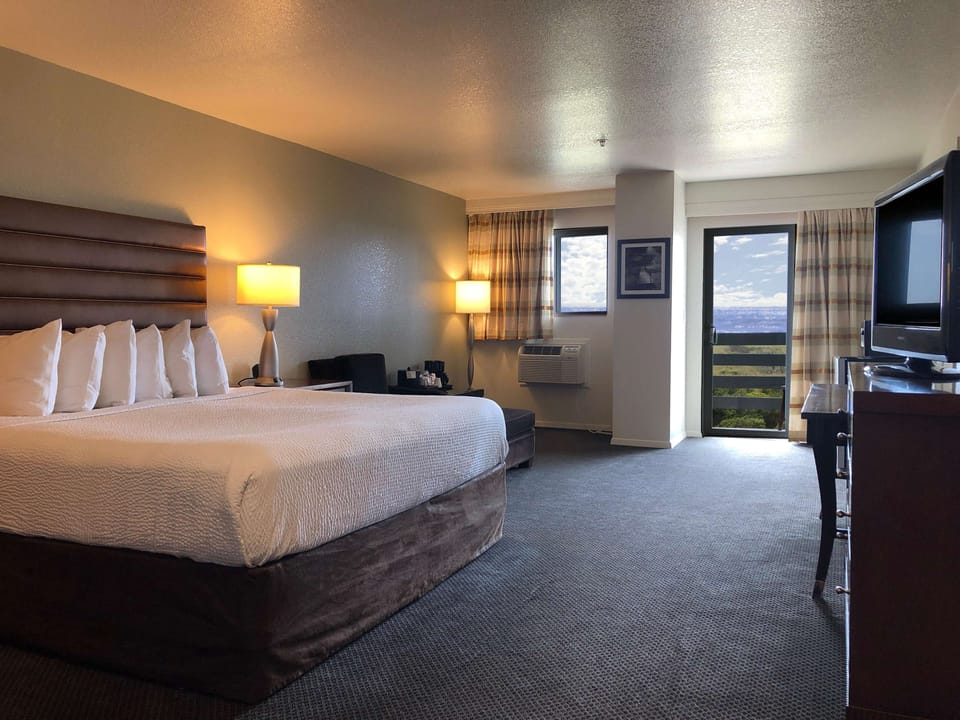 Suite, 1 King Bed, Non Smoking, Balcony (Lower Level) | Desk, blackout drapes, iron/ironing board, free cribs/infant beds