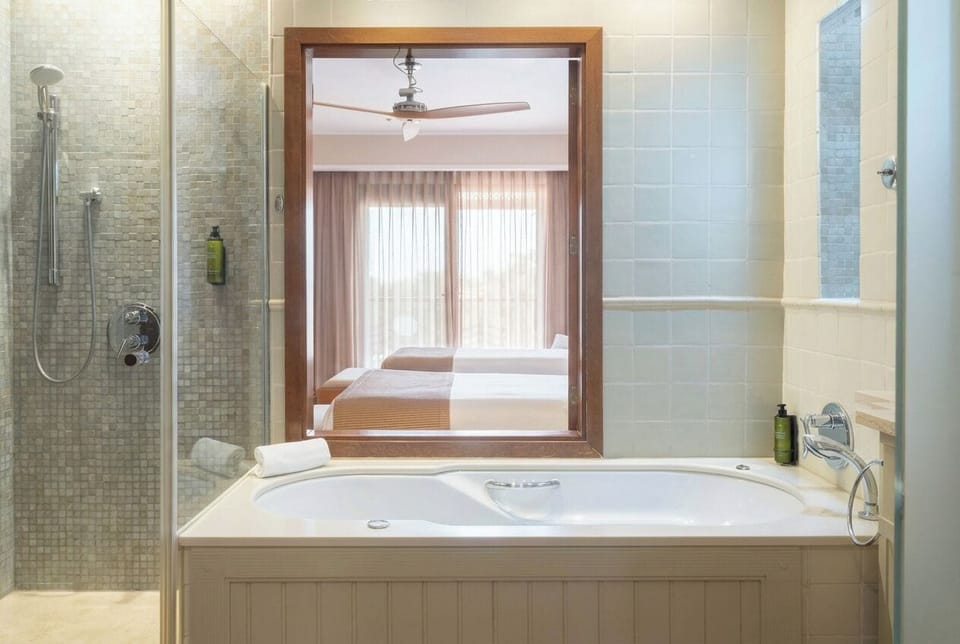 Shower, eco-friendly toiletries, hair dryer, bathrobes