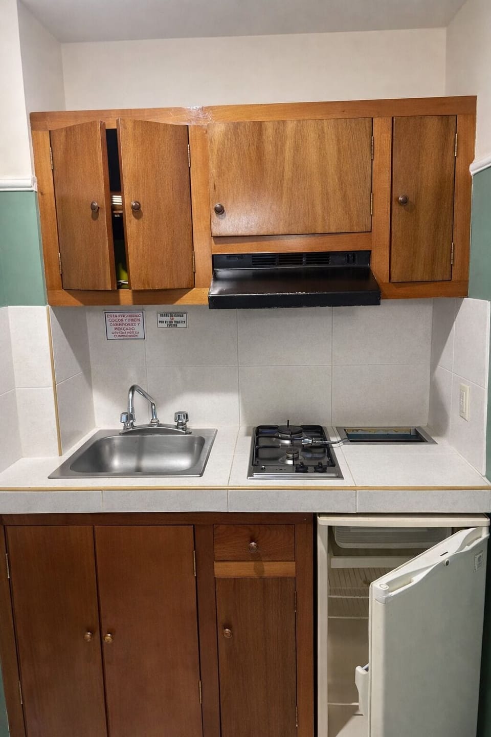 Mini-fridge, stovetop, coffee/tea maker, cookware/dishes/utensils