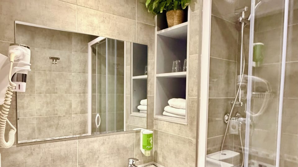 Shower, free toiletries, hair dryer, towels