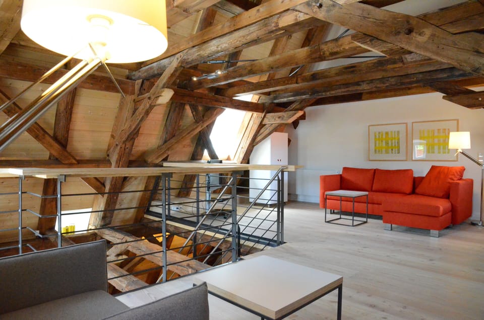 Deluxe Suite, 1 Bedroom | Living area | 32-inch flat-screen TV with satellite channels, TV