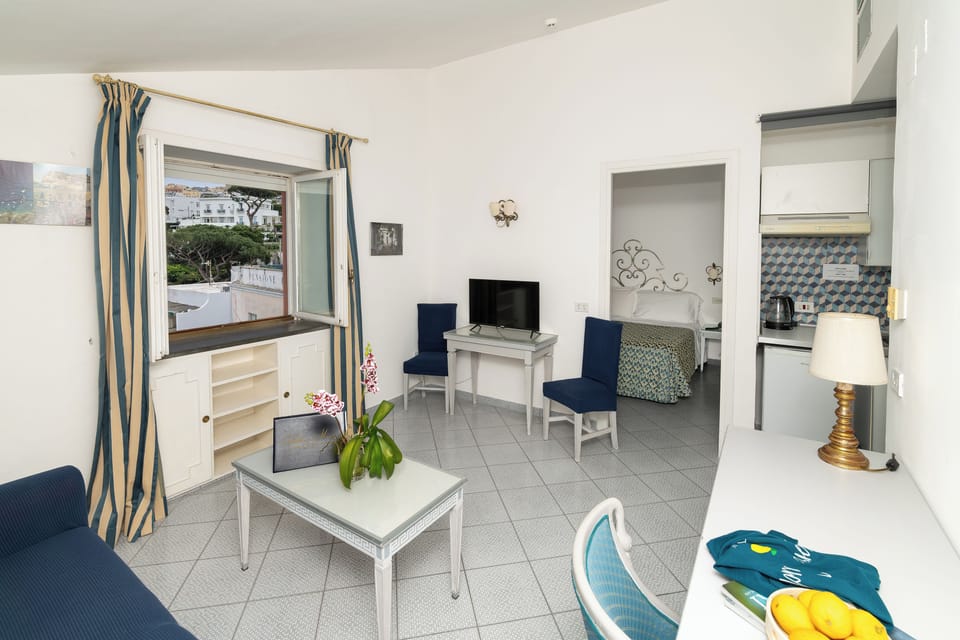 Superior Double Room, Sea View | Living area | 32-inch TV with digital channels