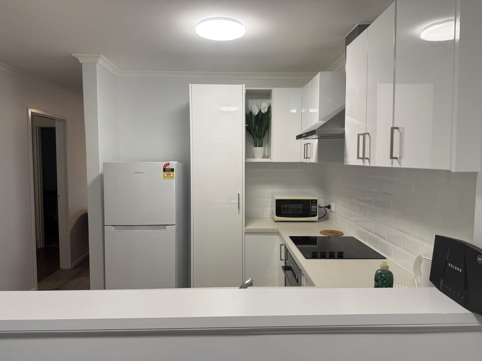 Premier Family Apartment, 2 Bedrooms (1 Queen, 1 Tri-bunk and 1 Sofa bed) | Private kitchen | Full-size fridge, microwave, oven, stovetop