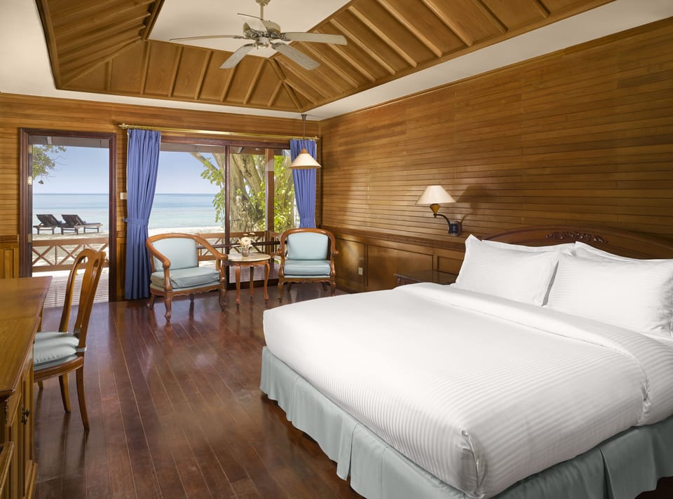 Deluxe Room, Multiple Beds, Beach View (Beach Villa) | Minibar, in-room safe, individually decorated, individually furnished