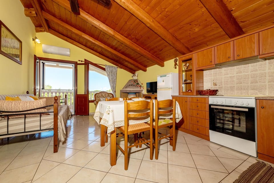 Apartment, 2 Bedrooms | Private kitchen | Fridge, stovetop, coffee/tea maker, electric kettle