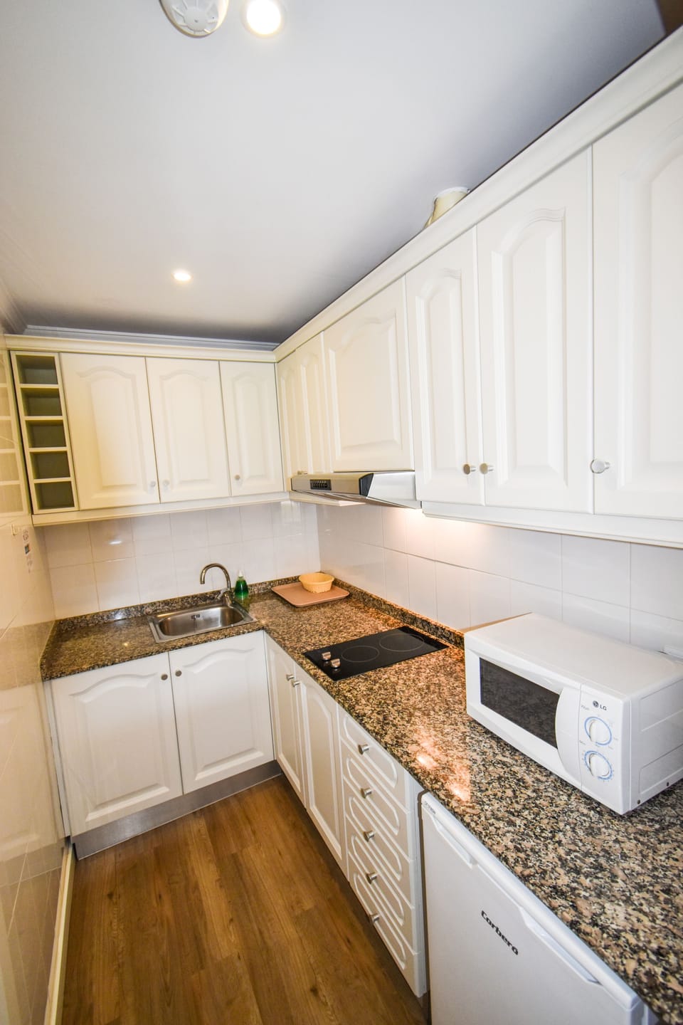 Fridge, microwave, stovetop, coffee/tea maker