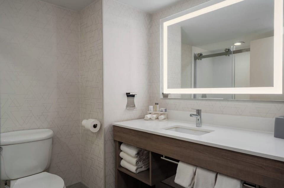 Combined shower/tub, hair dryer, towels, soap
