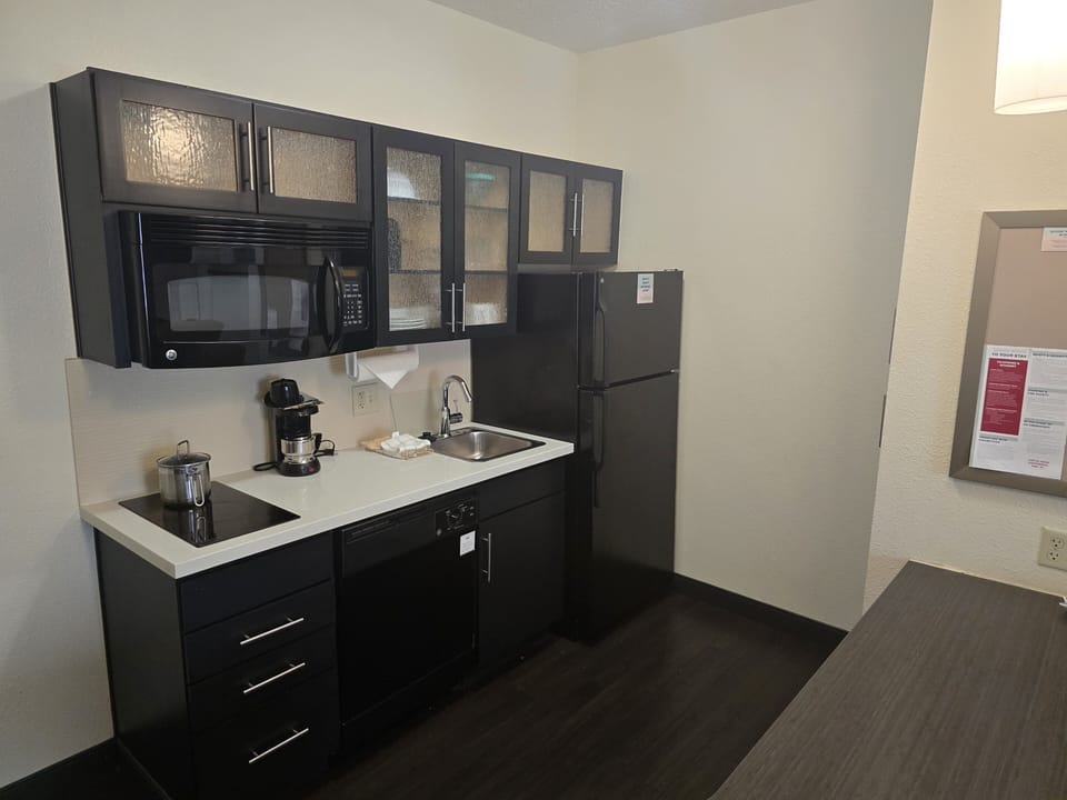 Suite, 1 Bedroom | Desk, blackout drapes, soundproofing, iron/ironing board