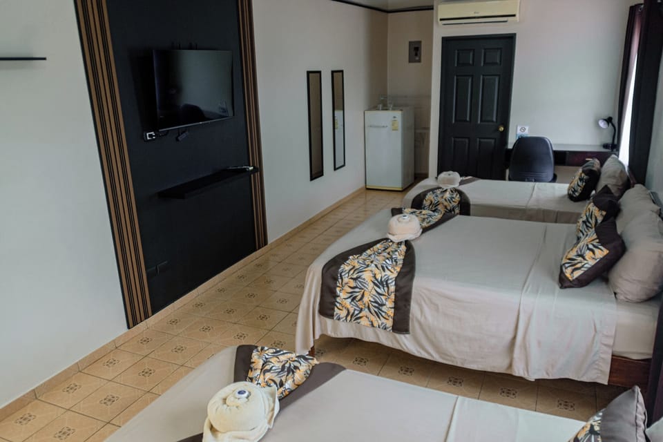 Premium bedding, desk, laptop workspace, blackout drapes