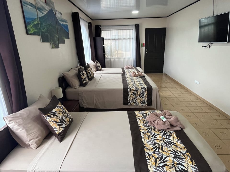 Premium bedding, desk, laptop workspace, blackout drapes