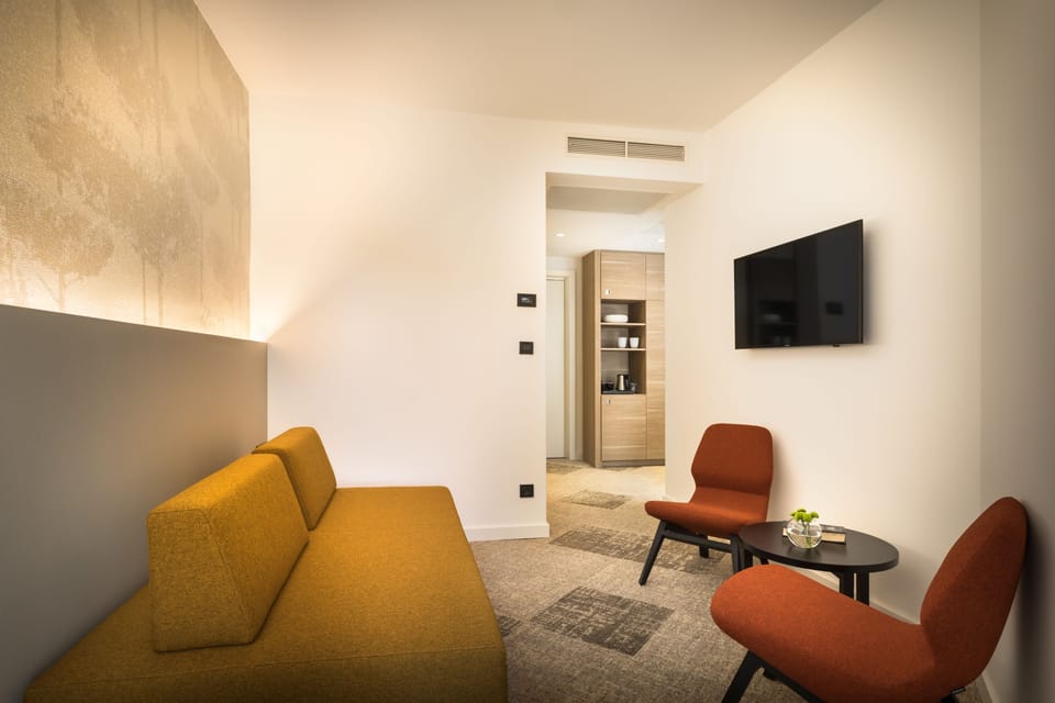 Family Room, 2 Bedrooms | Minibar, in-room safe, desk, blackout drapes