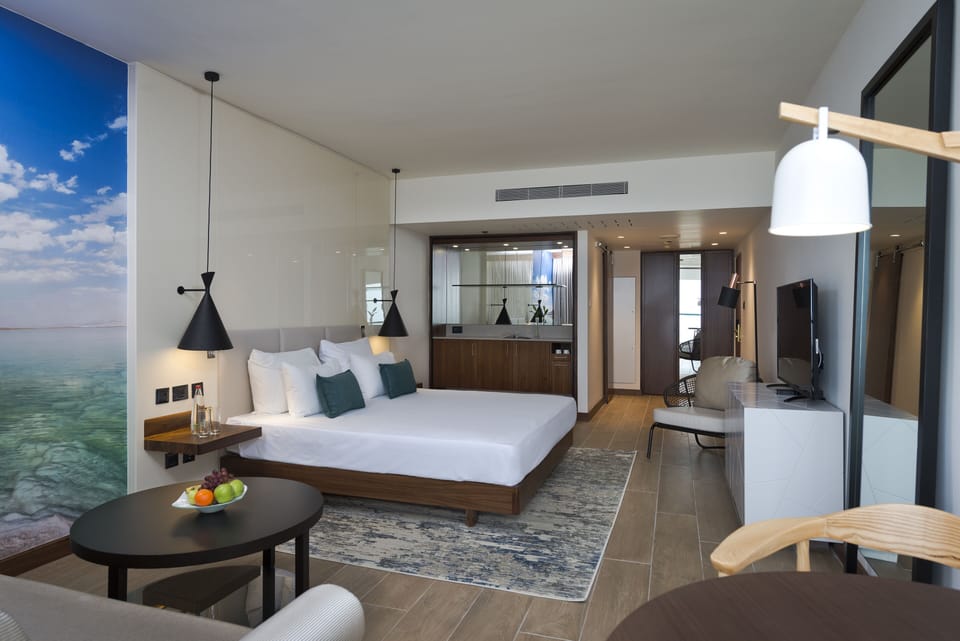 Family Room, Pool View (Moav) | Minibar, in-room safe, desk, iron/ironing board