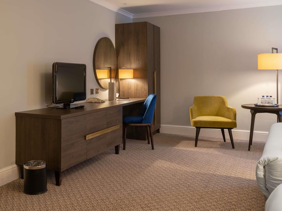 Desk, blackout drapes, iron/ironing board, free cribs/infant beds