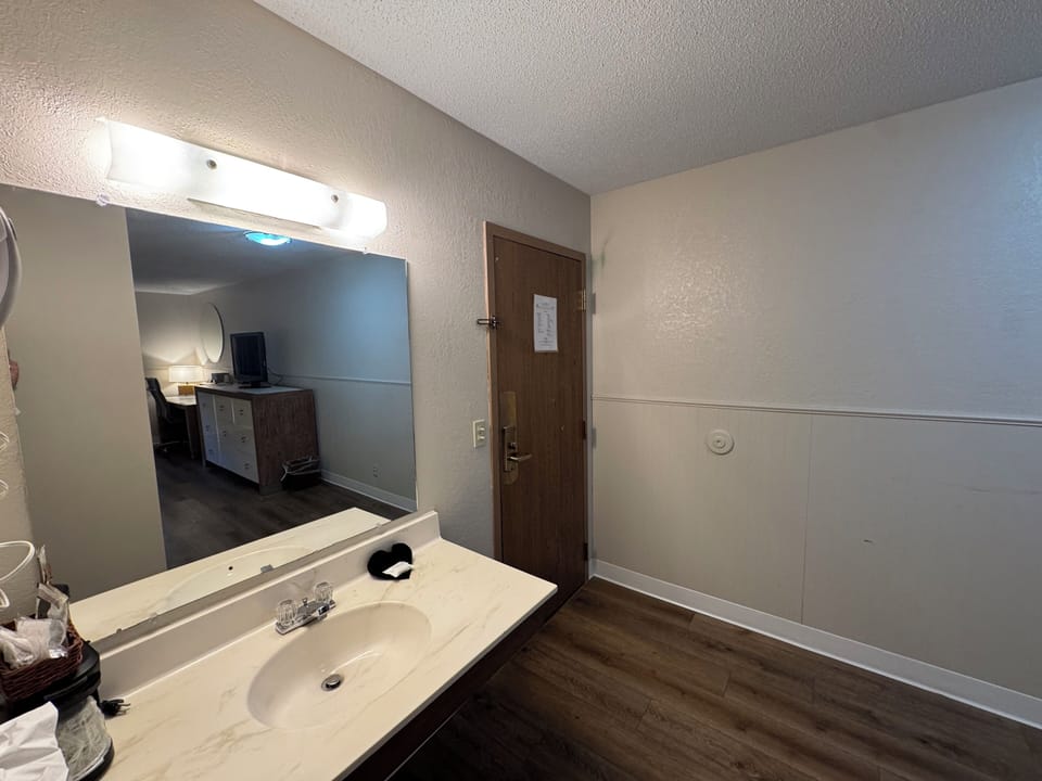 Basic Single Room | Blackout drapes, iron/ironing board, free WiFi, bed sheets