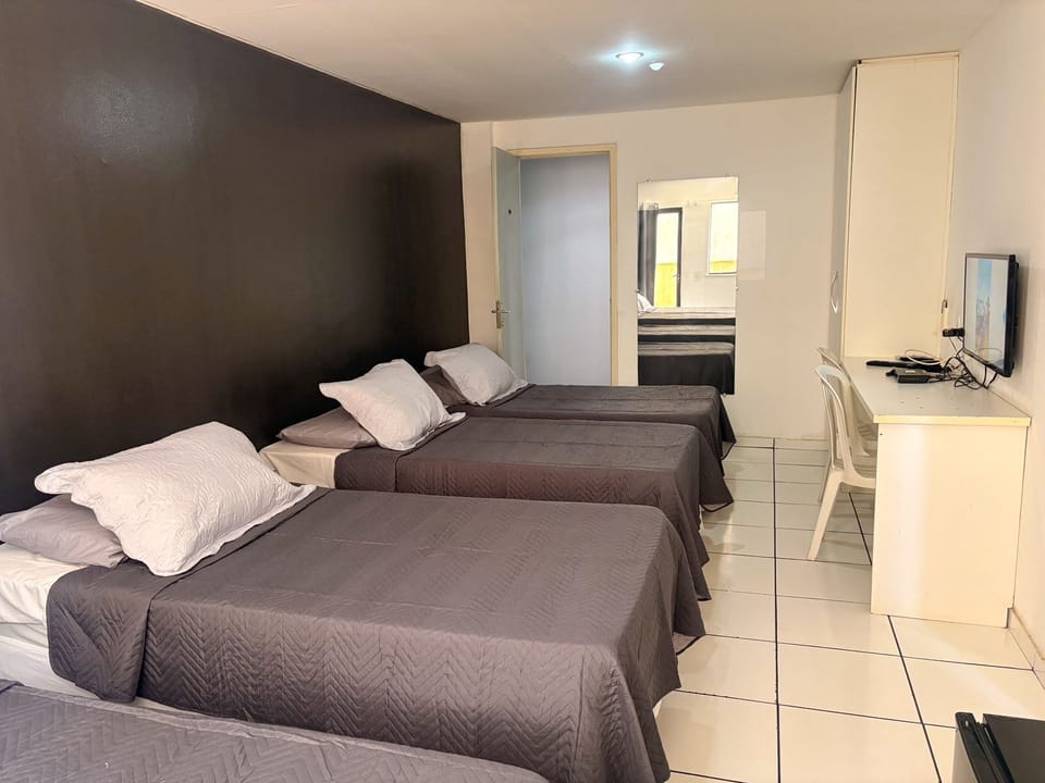Triple Room | Blackout drapes, free WiFi, bed sheets