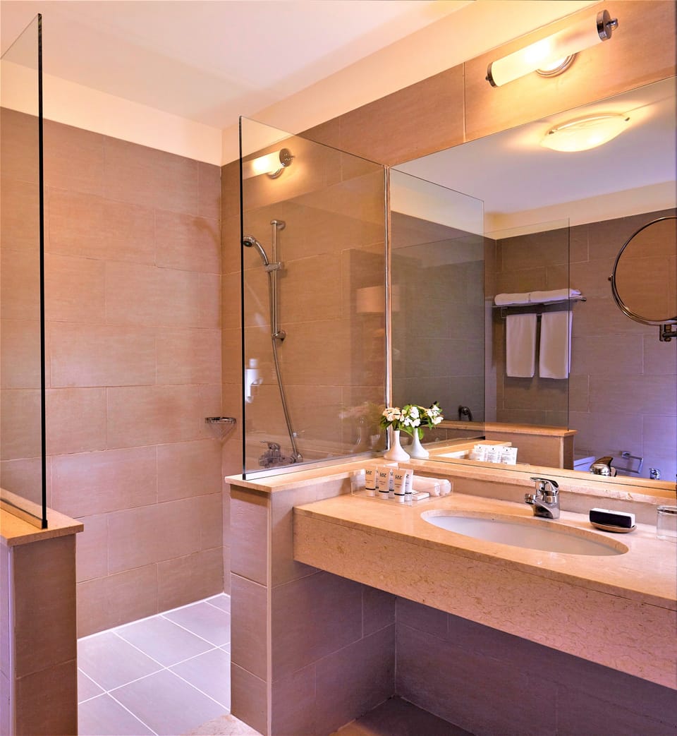 Shower, rainfall showerhead, eco-friendly toiletries, hair dryer