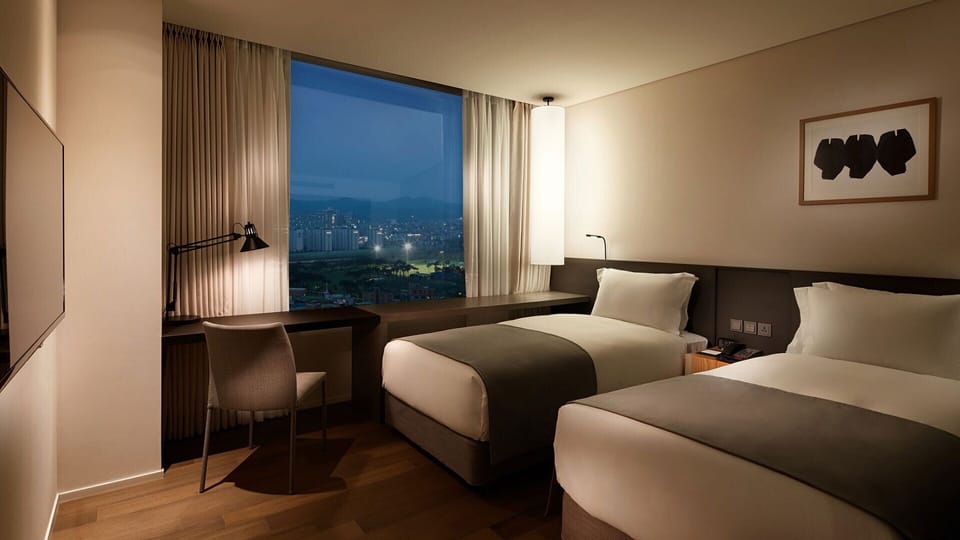 Premium bedding, down comforters, in-room safe, desk
