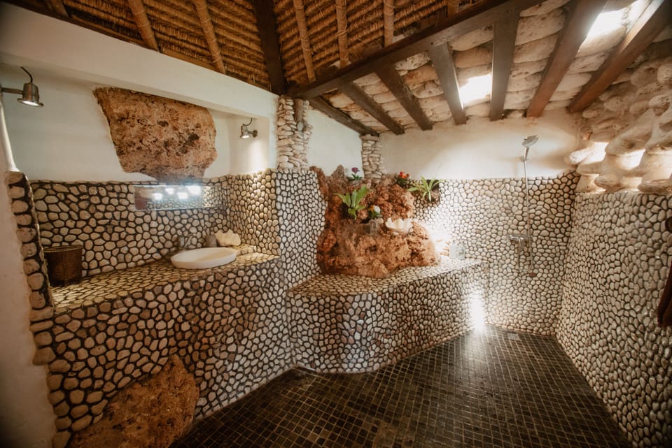 Deluxe Bungalow, Ocean View | Bathroom | Shower, hair dryer, towels, soap